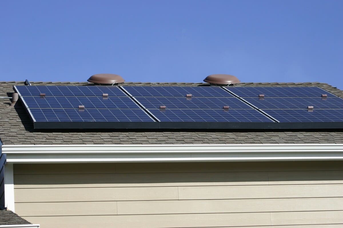 a solar panel on the roof of a house